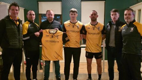 Ciaran Flynn of Metroscan presents new jerseys to the Cloghs